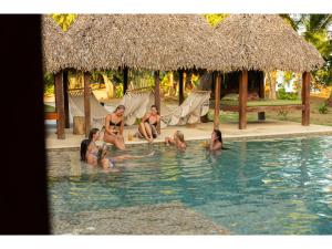 a group of people sitting in a swimming pool at Catalina's Hideaway in Santa Catalina