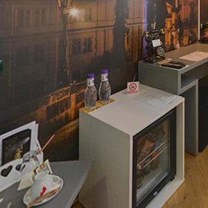 a room with two soda bottles on top of a tv at Ambra Boutique Hotel & Bistro in Constanţa
