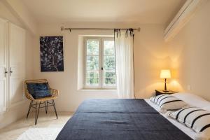 Łóżko lub łóżka w pokoju w obiekcie Le Mas Paradou, 5 chambres, piscine privée, accès au village à pied