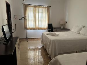 Foto de la galeria de Quarto com / Bosque / Estoril / SJC a São José dos Campos