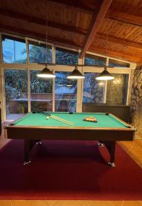 a pool table in the middle of a room at VILLA LOVRAN - 150m to the beach - infinity pool - incredible sea view - Fitnessraum in Lovran