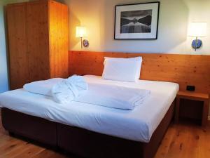 Posteľ alebo postele v izbe v ubytovaní Hotel Orso Grigio
