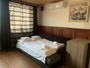 Posteľ alebo postele v izbe v ubytovaní Prána Apartman
