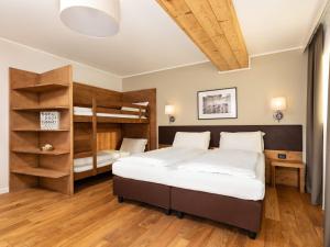 Posteľ alebo postele v izbe v ubytovaní Hotel Orso Grigio