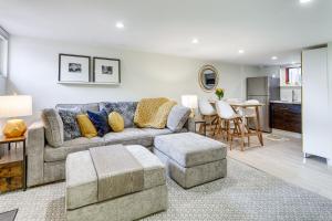 a living room with a couch and a table at Stylish Pet-Friendly Denver Gem, 2 Mi to Downtown! in Denver