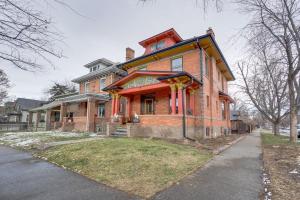 a large brick house on the side of a street at Stylish Pet-Friendly Denver Gem, 2 Mi to Downtown! in Denver