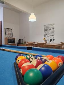 a pool table with a bunch of balls on it at The Gatherings Place in Melaka