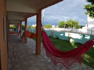a couple of hammocks on the outside of a house at Vila Harmonia in Conde
