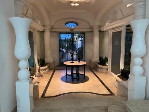 a room with a table in the middle of a building at Relais Corte Degli Aragonesi in Ischia