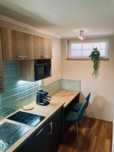 Kuchyň nebo kuchyňský kout v ubytování Spengler Apartman