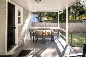 a porch with a table and chairs on it at Salisbury Hideaway in Salisbury