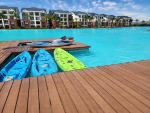 a group of kayaks sitting on a dock in a pool at 297 The Blyde Crystal Lagoon in Pretoria