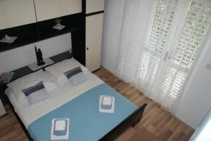 Posteľ alebo postele v izbe v ubytovaní Korčula Guest House
