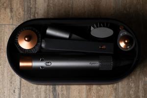 a bottle of lipstick sitting on top of a cell phone at CadensPlace - Overlooking Piazza Navona by dbalconycollection in Rome