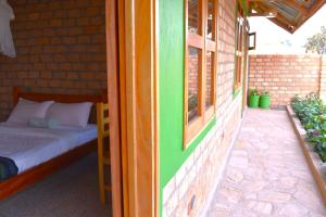 Postel nebo postele na pokoji v ubytování Iziba Lodge - Hoima