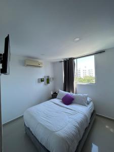 Postel nebo postele na pokoji v ubytování Hotel Sun Suite