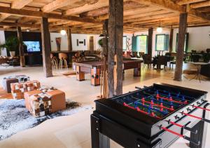 a large living room with a ping pong table at Fazenda Borges in Rio Piracicaba