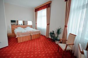 Postel nebo postele na pokoji v ubytování Hotel Grand