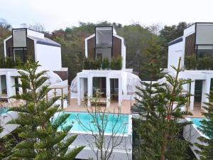 a villa with a swimming pool and a resort at The X10 Nordic Tent and Glamping Pool Villa Khaoyai เขาใหญ่ - SHA Certified in Ban Thung Sawang