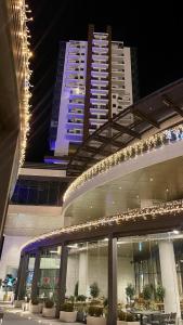 a building with lights on top of it at night at Diamond of Skopje Luxury apartment 19th floor in Skopje
