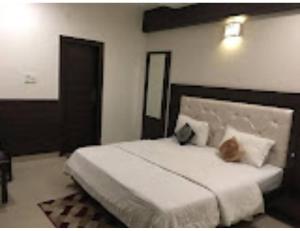Krevet ili kreveti u jedinici u objektu Hotel Kimaya, Kurukshetra