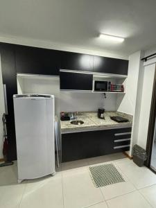 Una cocina o kitchenette en Studio Acqua - estilo no melhor bairro da cidade