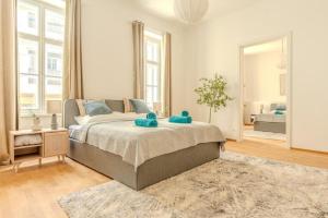 a bedroom with a bed with two teddy bears on it at Deluxe Apartments near the center in Krems an der Donau