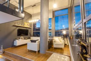 a living room with a view of the city at View Skyscraper Bata - loft XL in Zlín