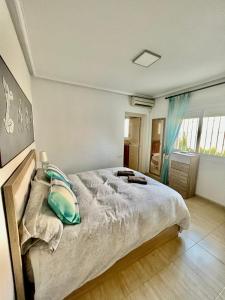 a bedroom with a large bed in a room at Villa Calma in Ciudad Quesada +21 photos