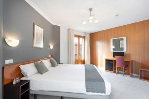 Łóżko lub łóżka w pokoju w obiekcie Hotel Alda Ciudad de Toro