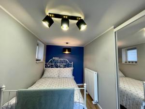 En eller flere senger på et rom på Apartamenty Grunwaldzka 96