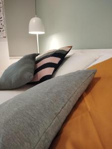 A bed or beds in a room at 111 ColaDiRienzo Rooms - by AD Roma