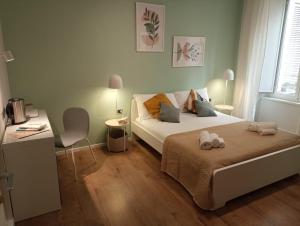 A bed or beds in a room at 111 ColaDiRienzo Rooms - by AD Roma