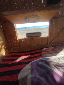 a view of the beach from the inside of a boat at Makany Makanak Camp in Dahab