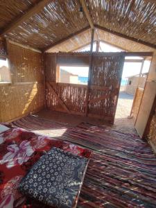 an inside view of a small room with rugs at Makany Makanak Camp in Dahab