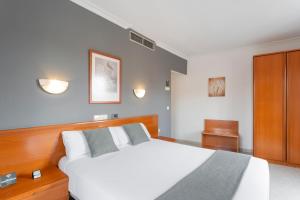 Łóżko lub łóżka w pokoju w obiekcie Hotel Alda Ciudad de Toro