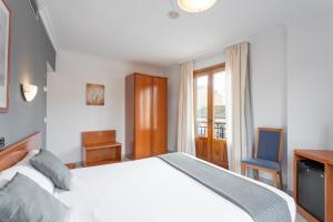 Łóżko lub łóżka w pokoju w obiekcie Hotel Alda Ciudad de Toro