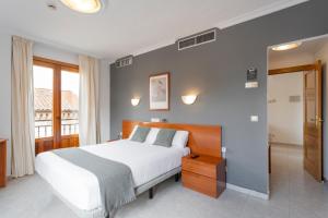 Łóżko lub łóżka w pokoju w obiekcie Hotel Alda Ciudad de Toro