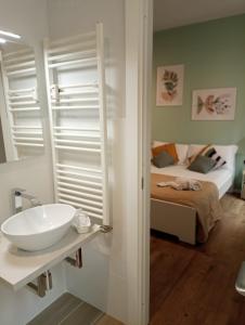 A bed or beds in a room at 111 ColaDiRienzo Rooms - by AD Roma