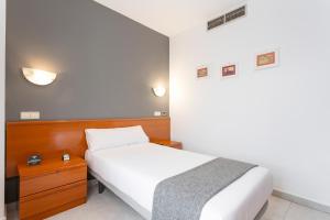 Giường trong phòng chung tại Hotel Alda Ciudad de Toro