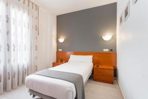 Łóżko lub łóżka w pokoju w obiekcie Hotel Alda Ciudad de Toro