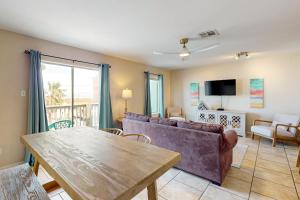 a living room with a couch and a table at Leeward 9303 in Padre Island
