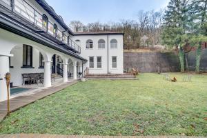 a house with a yard in front of it at Unique Wheeling Condo in Historical Monastery! in Wheeling