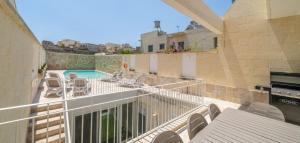 A balcony or terrace at Ta Spiru House of Character with heated indoor pool