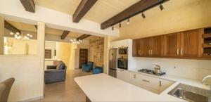 A kitchen or kitchenette at Ta Spiru House of Character with heated indoor pool