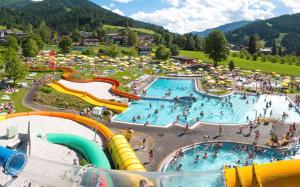 a large water park with several pools and slides at Ferienhaus Zentral in Wagrain