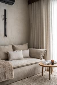 a living room with a couch and a table at Apartamenty Podhale in Zakopane