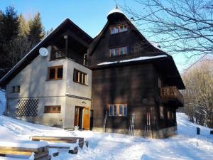 a large house in the snow with snow at Chata Mir in Dolní Bečva