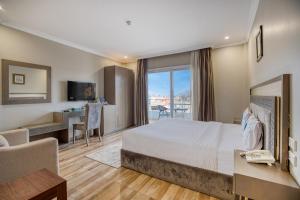 Postel nebo postele na pokoji v ubytování Mamlouk Pyramids Hotel