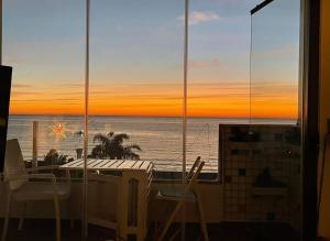 a view of the ocean from a room with a window at Apartamento privado en Hotel Sol Aloha in Torremolinos